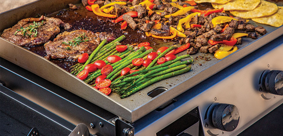 A variety of food on a griddle